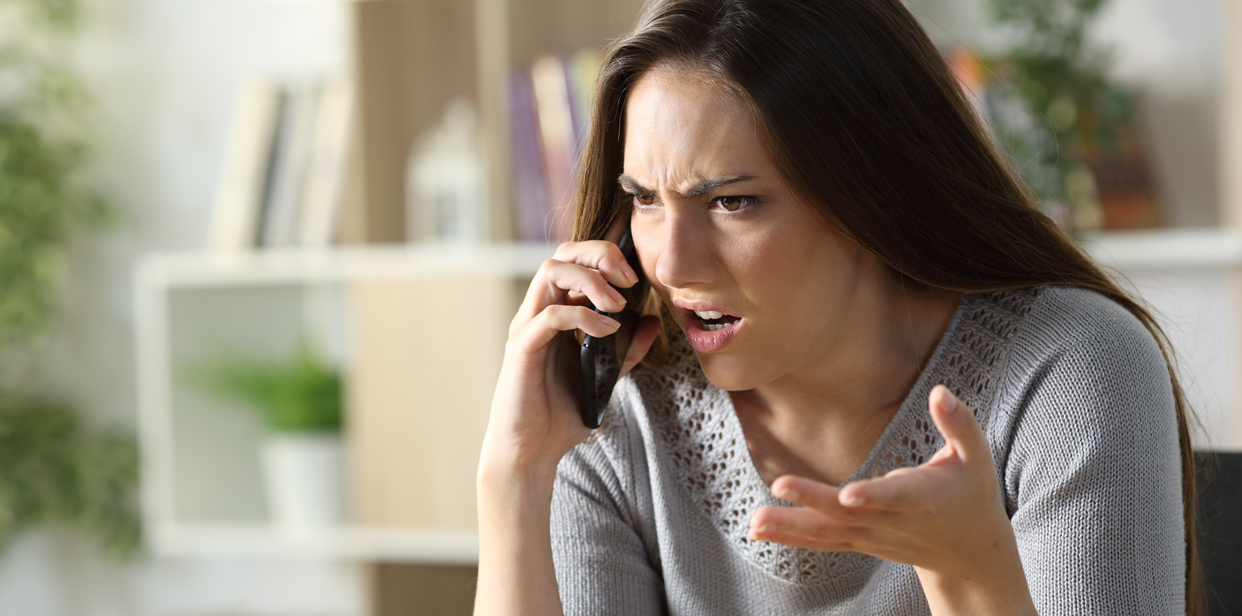 Woman on phone looking annoyed